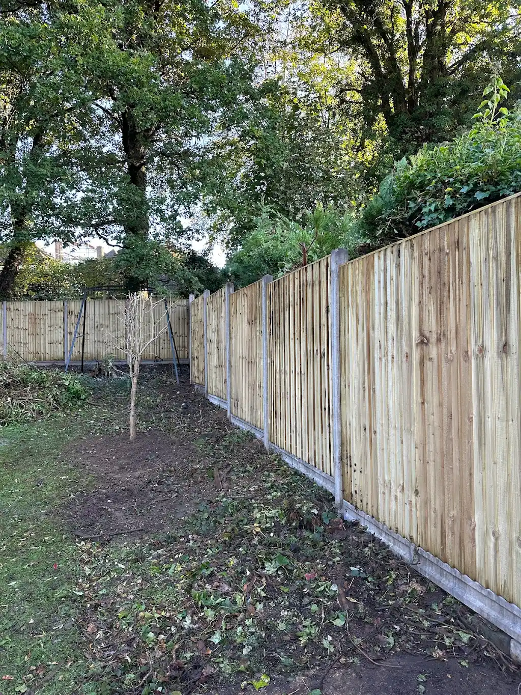 Closeboard fence installation with concrete posts
